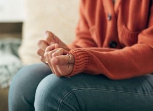 Woman with Trauma or worry sitting down